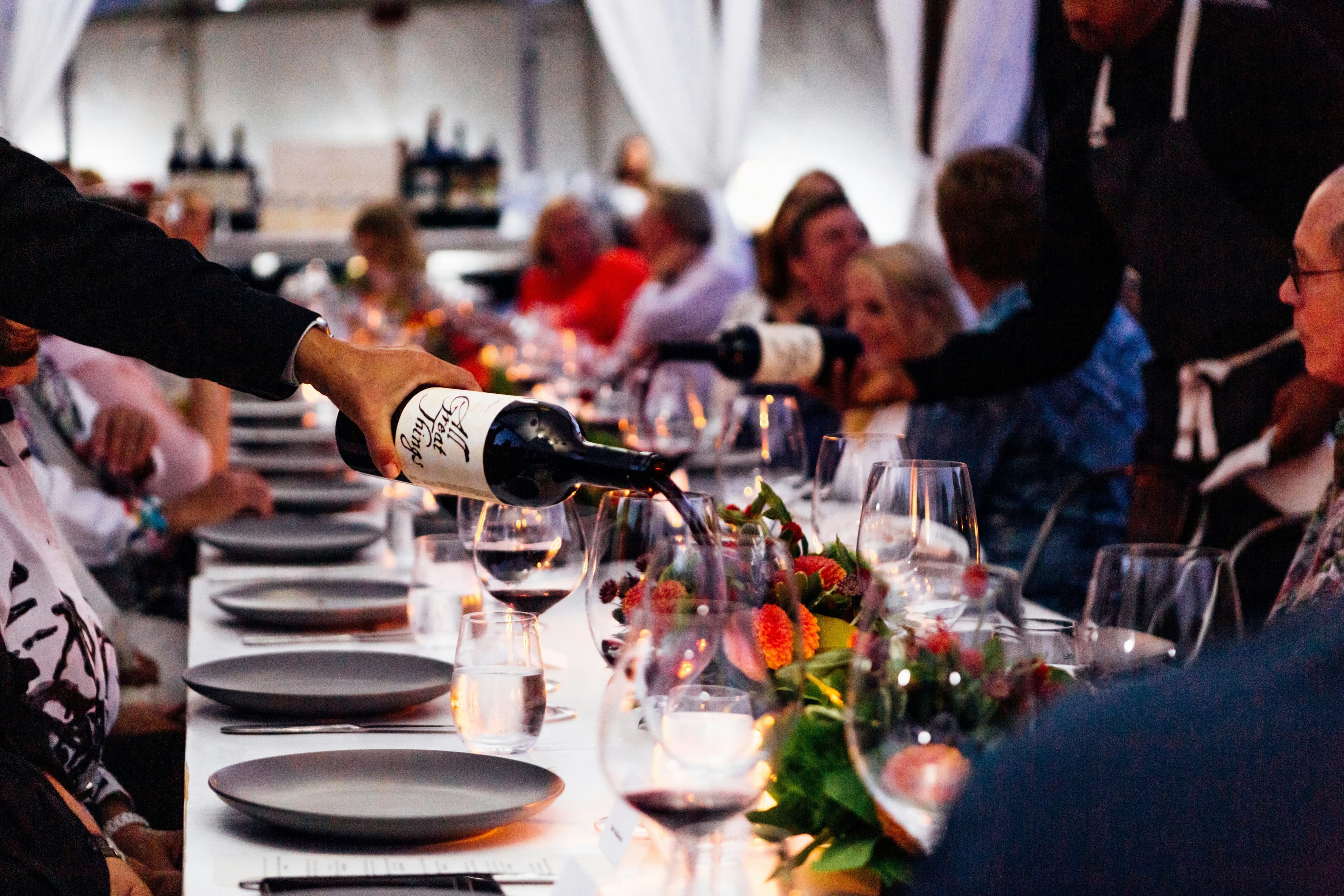 Tables set for a corporate dinner (stand-in photo)